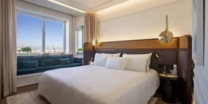 Bed and sofa in a sunny day of the Premium Room