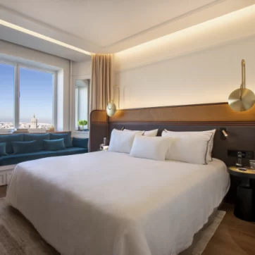 Bed and sofa in a sunny day of the Premium Room